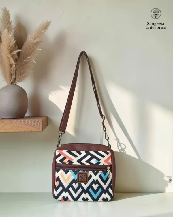 Jute premium square bag – black, white and orange chevron print Jute premium square bag in black, white and orange chevron print, made by Sangeeta Enterprise, Nagpur