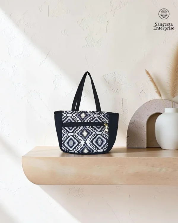 Kitty handy bag in black and white ikat print, made by Sangeeta Enterprise, Nagpur
