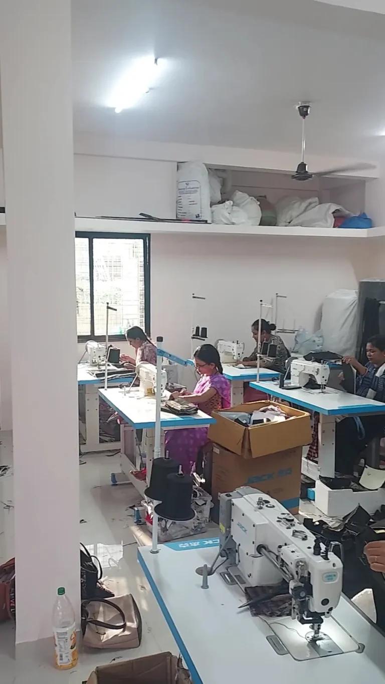 Tailors stitching bags on sewing machines at the Sangeeta Enterprise bag factory in Nagpur