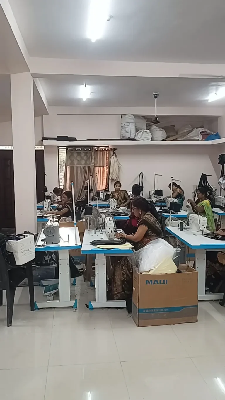 Rows of sewing machines and workers on the bag stitching floor in Nagpur