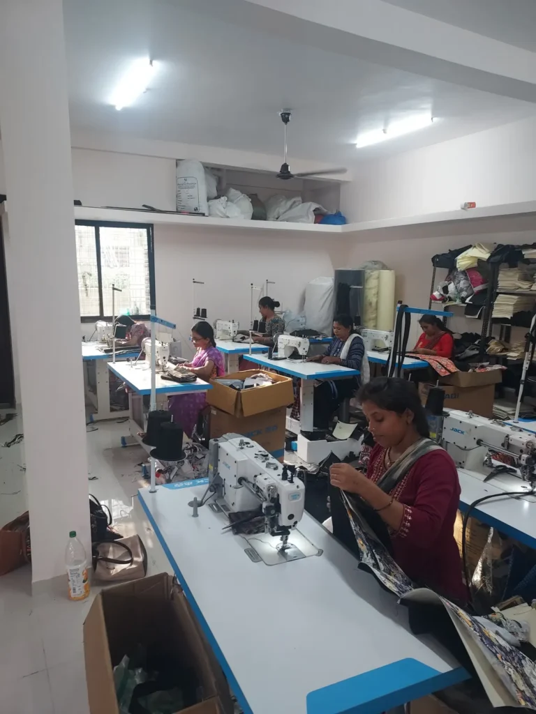 Woman operator stitching a bag on the production floor, Sangeeta Enterprise Nagpur